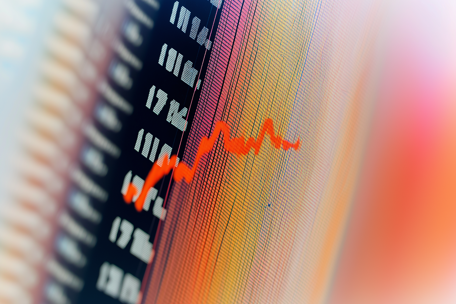 A marketing professional intently reviewing data on a computer screen, planning a media campaign with brand safety in mind.