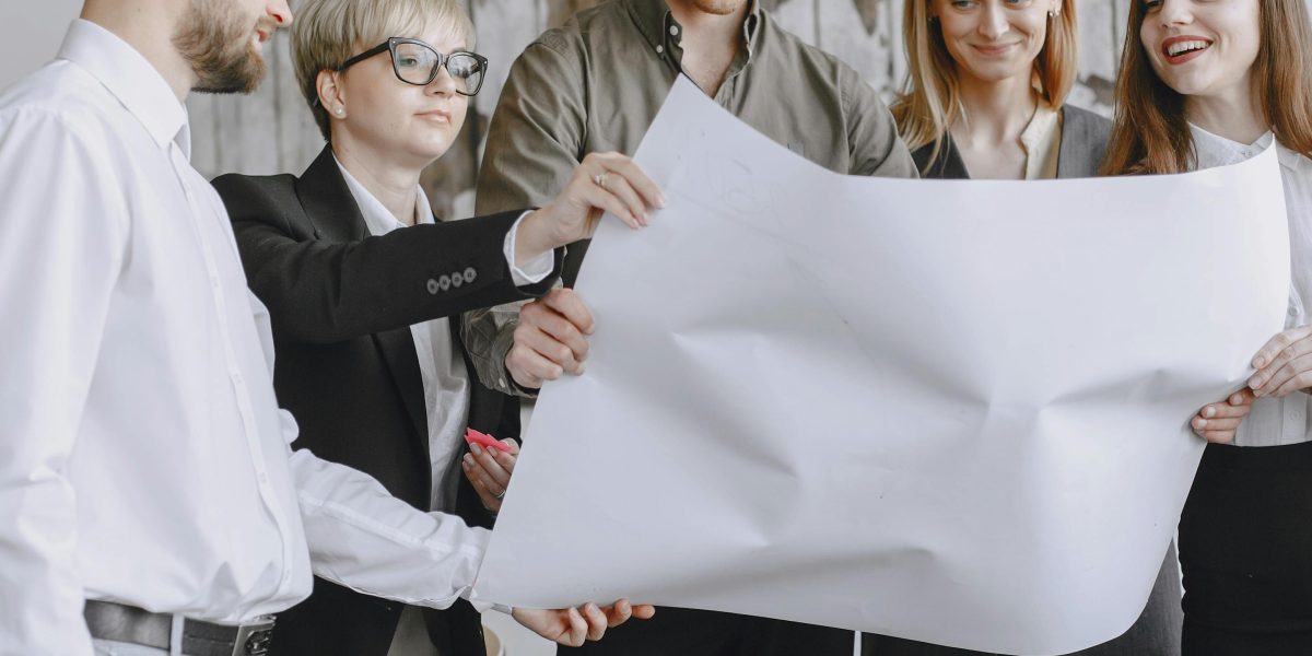 A team of professionals collaborating on a strategic plan, reflecting the success of a PR agency in streamlining workflows.