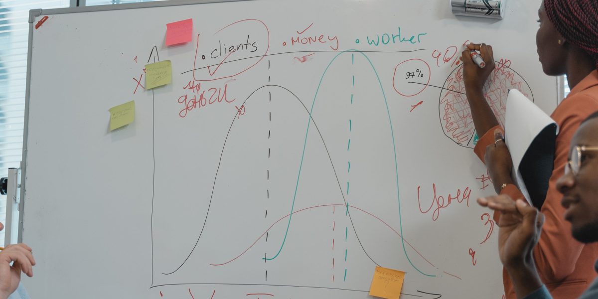A marketing team collaborating in an office setting, strategizing based on media patterns and audience data.