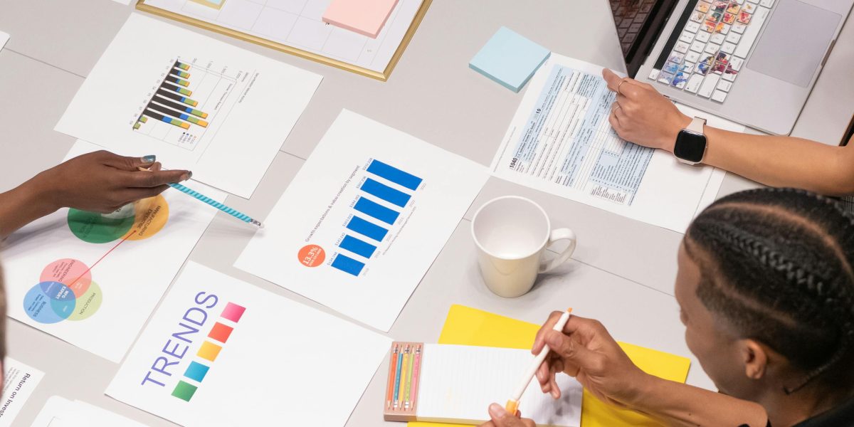 A professional team collaborates on brand safety and media strategy, understanding the influence of newspaper ownership.