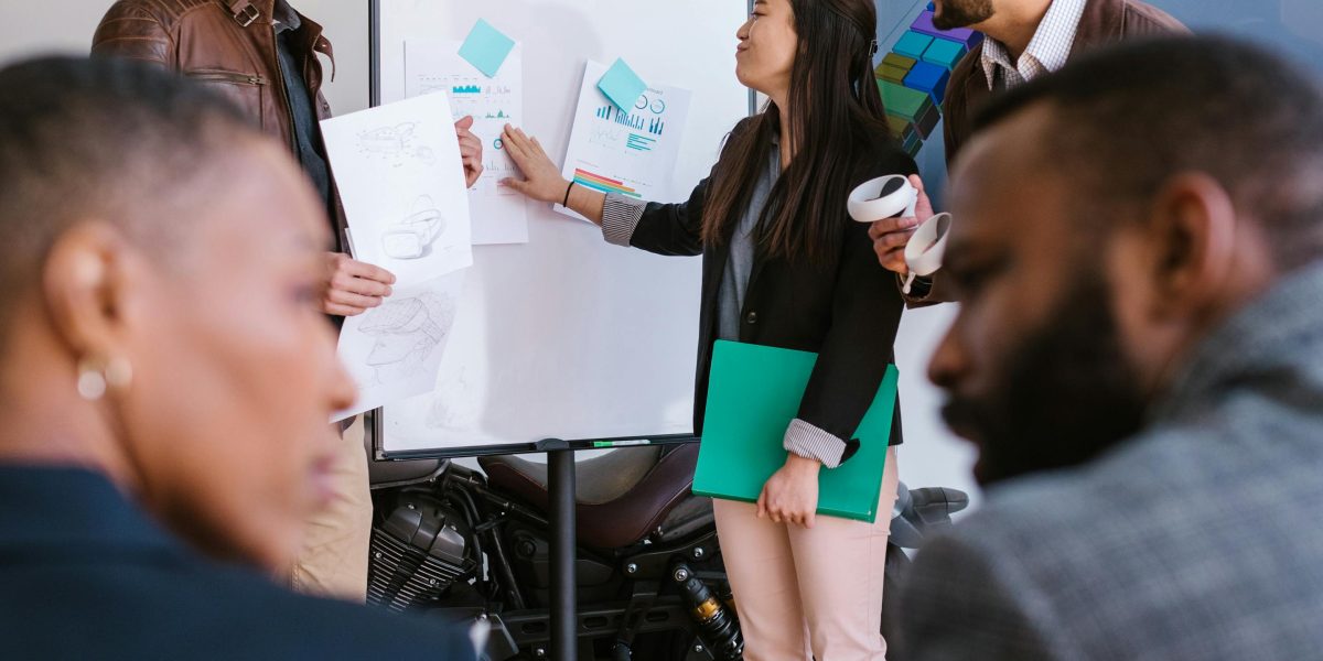A team collaborates and brainstorms ideas for a marketing or PR campaign, using data to inform their strategy.