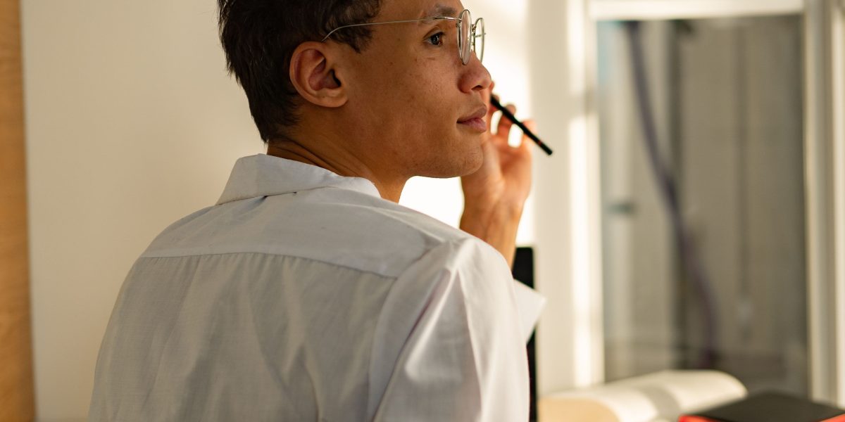 A person contemplating choices, reflecting the challenge of making smart media decisions in a low-trust environment.