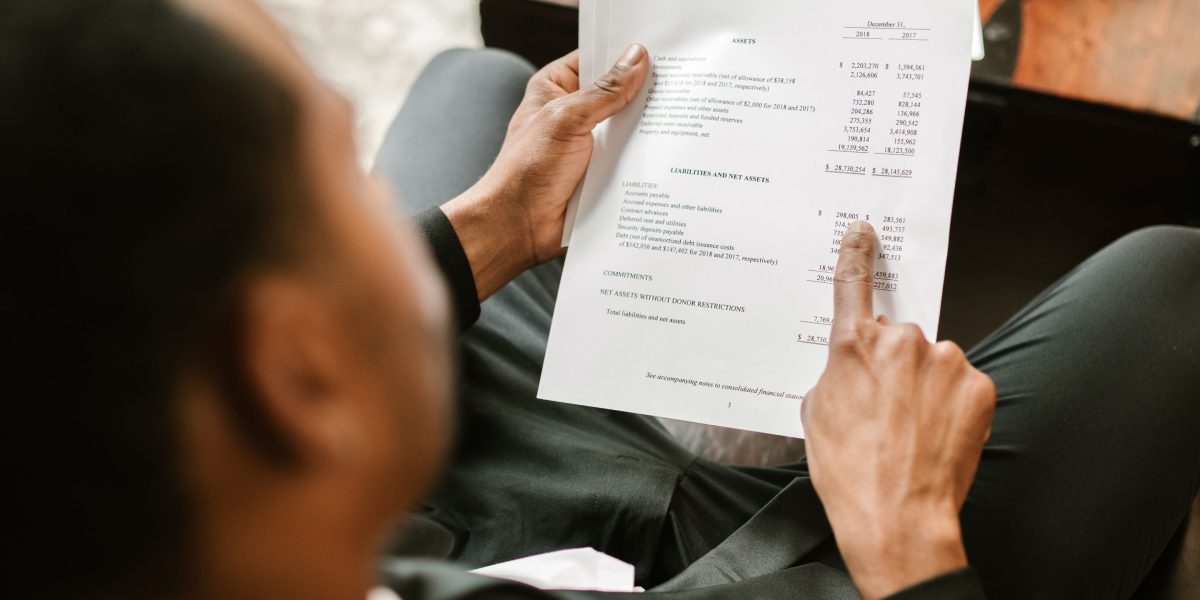 An individual carefully evaluates information to make an informed decision amidst a flood of content.