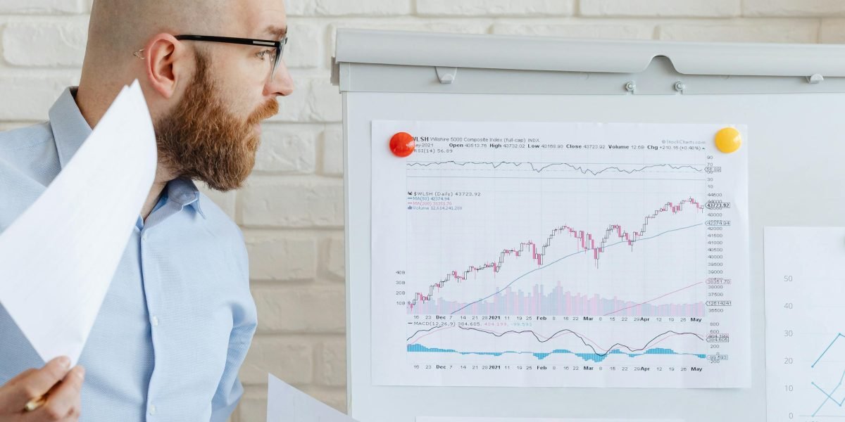 A business professional confidently reviewing data and reports, symbolizing ROI analysis.