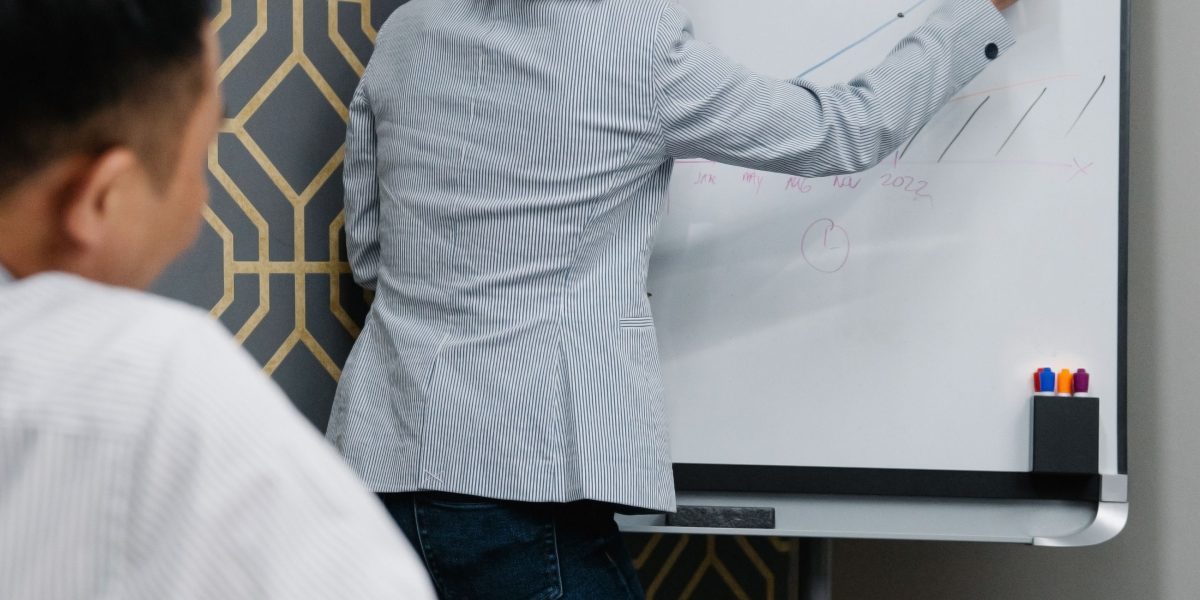A team actively collaborating, demonstrating the integration of a new workflow into daily media planning operations.