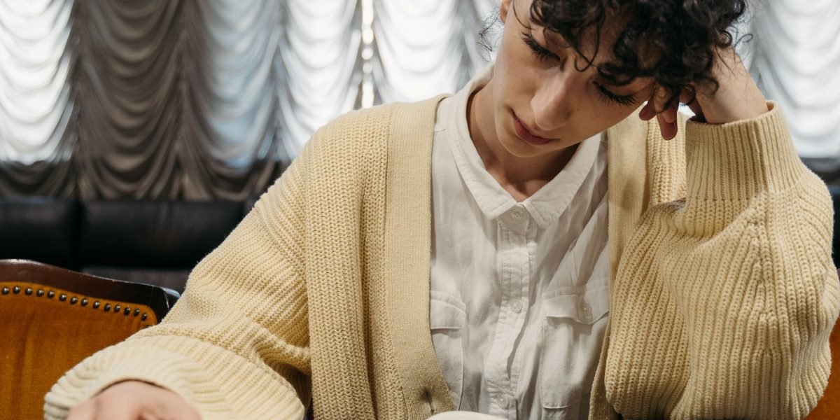 A person intently examining historical documents, piecing together information to form a complete understanding of the past.
