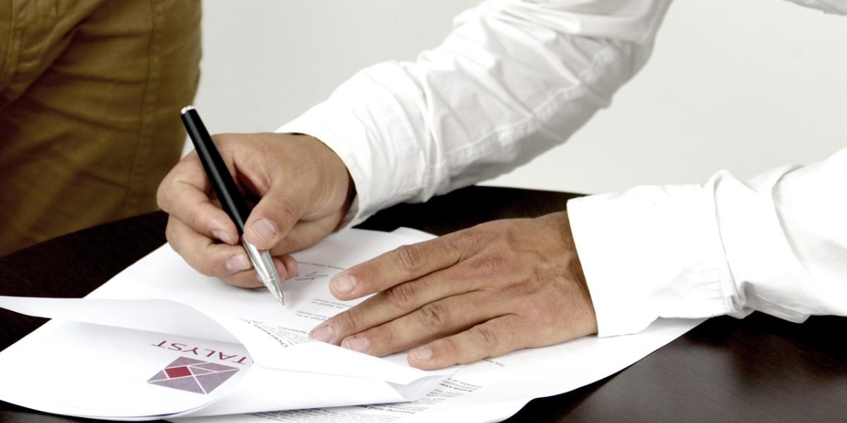 A person thoughtfully assessing the credibility and potential biases of various documents during a research task.