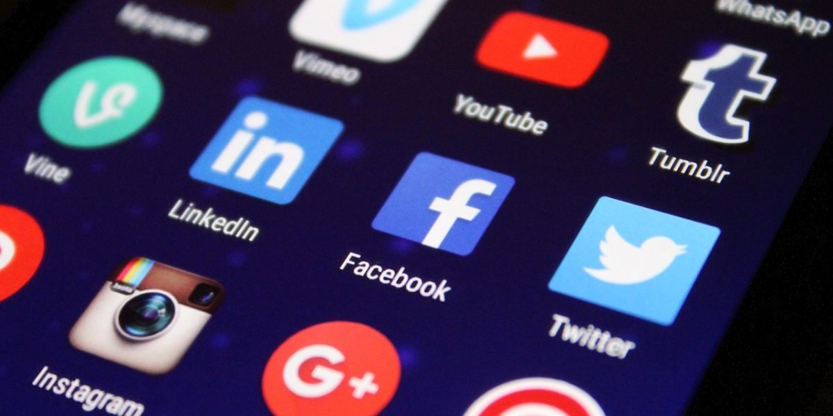 A person scrolling through social media feeds on a smartphone, representing the constant influx of digital news and potential for sensational content.
