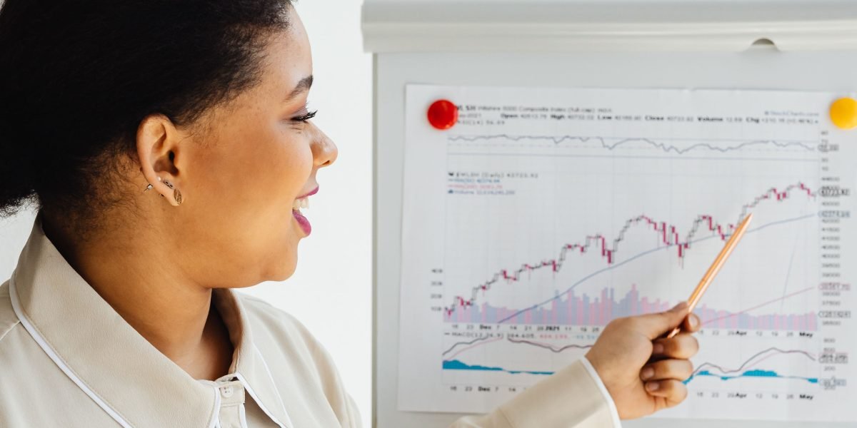 A person confidently presenting information to a group, illustrating the importance of ongoing training and guidance.