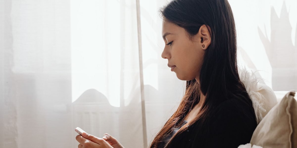 A thoughtful individual making conscious decisions about their online data privacy settings.