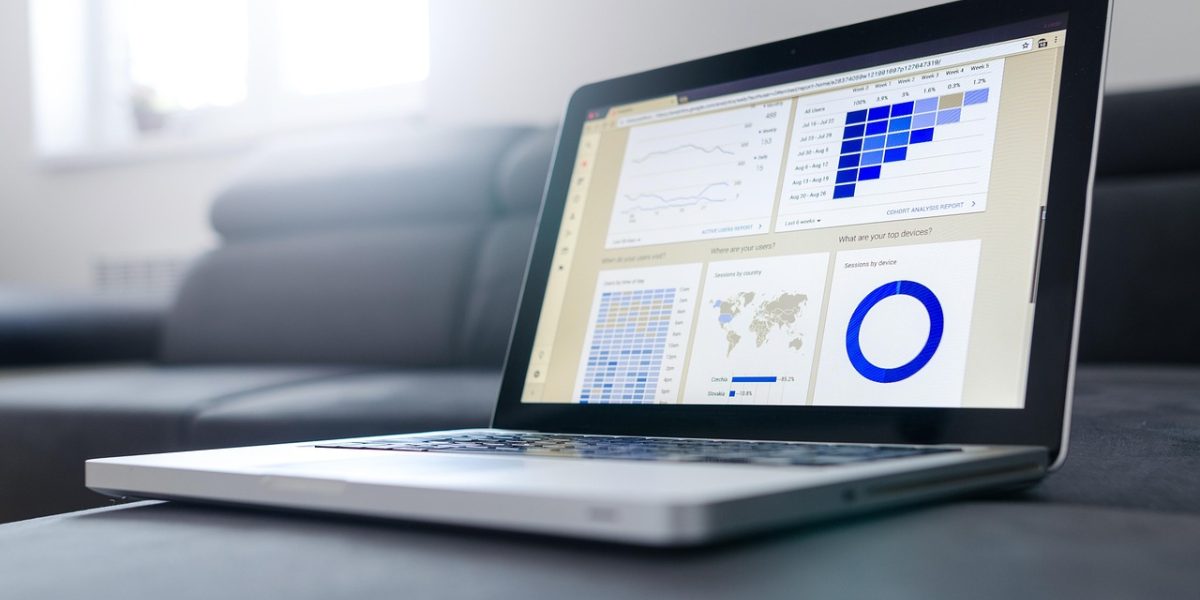 A professional meticulously reviewing a comprehensive data dashboard, highlighting the importance of integrated analytics for multi-platform strategies.