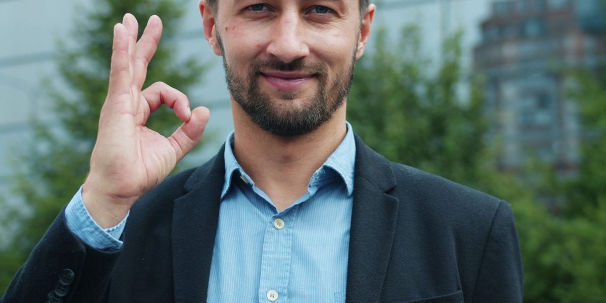 A young professional celebrating a career achievement, symbolizing the positive impact of certification on job prospects and salary.