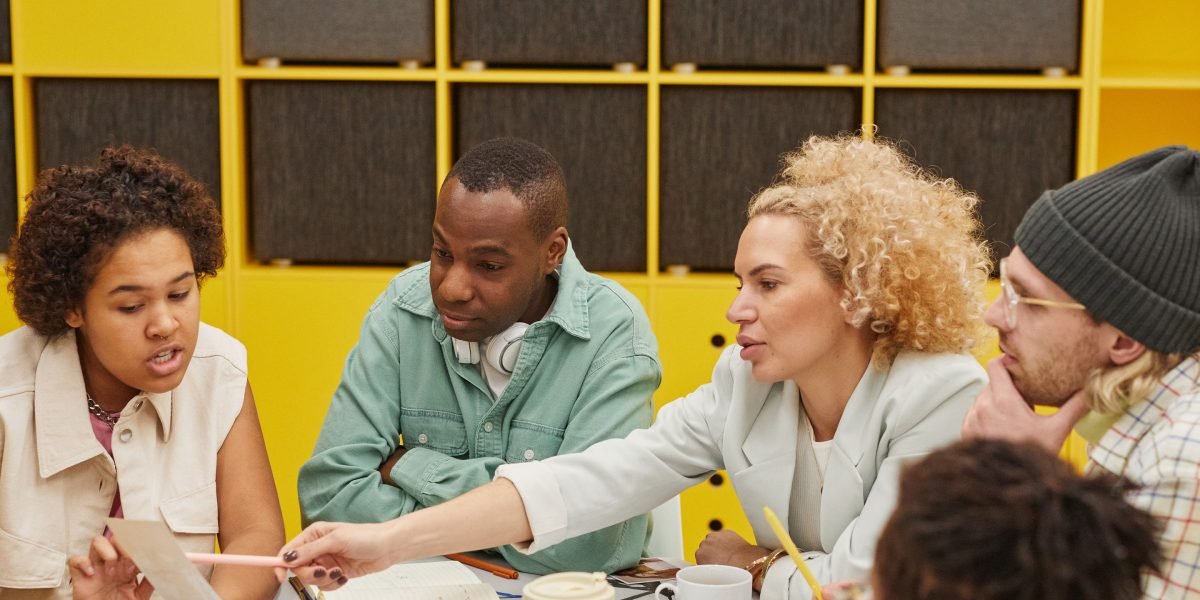 A team actively collaborating on a strategic plan, evaluating options and making informed decisions for advertising channels.