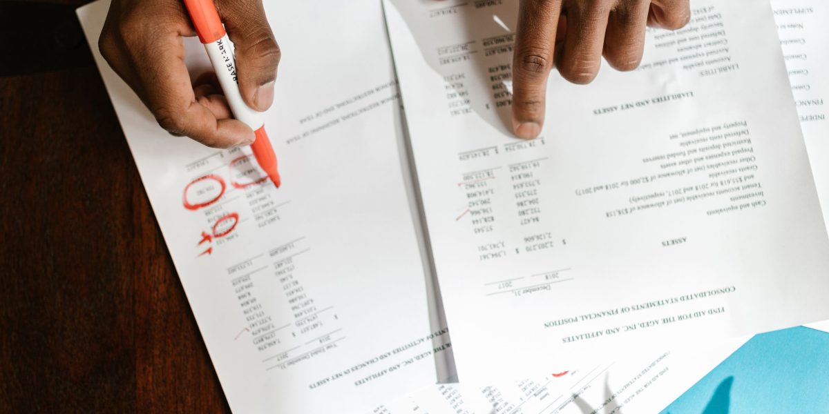 A business person diligently reviewing charts and reports, analyzing campaign performance.